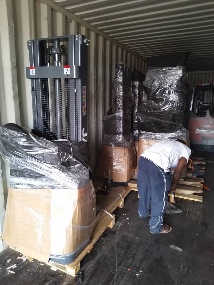 Unloading equipment from a container